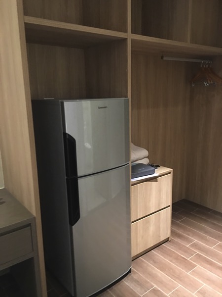 D'Resort - inside Park View room - fridge and open cabinet