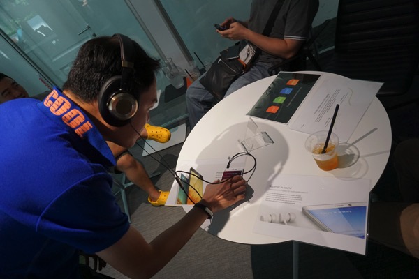 MiNote launch experiential event 2015 - testing out with headphones